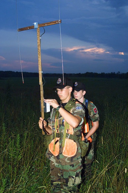 Civil Air Patrol members practice searching for an emergency locator transmitter at the National Emergency Services Academy. The member in front is using an L-Tronics Little L-Per, a type of radio direction finder.